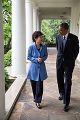 Barack Obama walks with President Park Geun-hye of the Republic of Korea, 2013.jpg